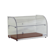 Two-tier curved glass cake display with walnut base and metal hinges.