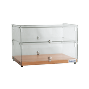Two-tier ambient cake display with clear glass panels and natural oak base, silver knobs.