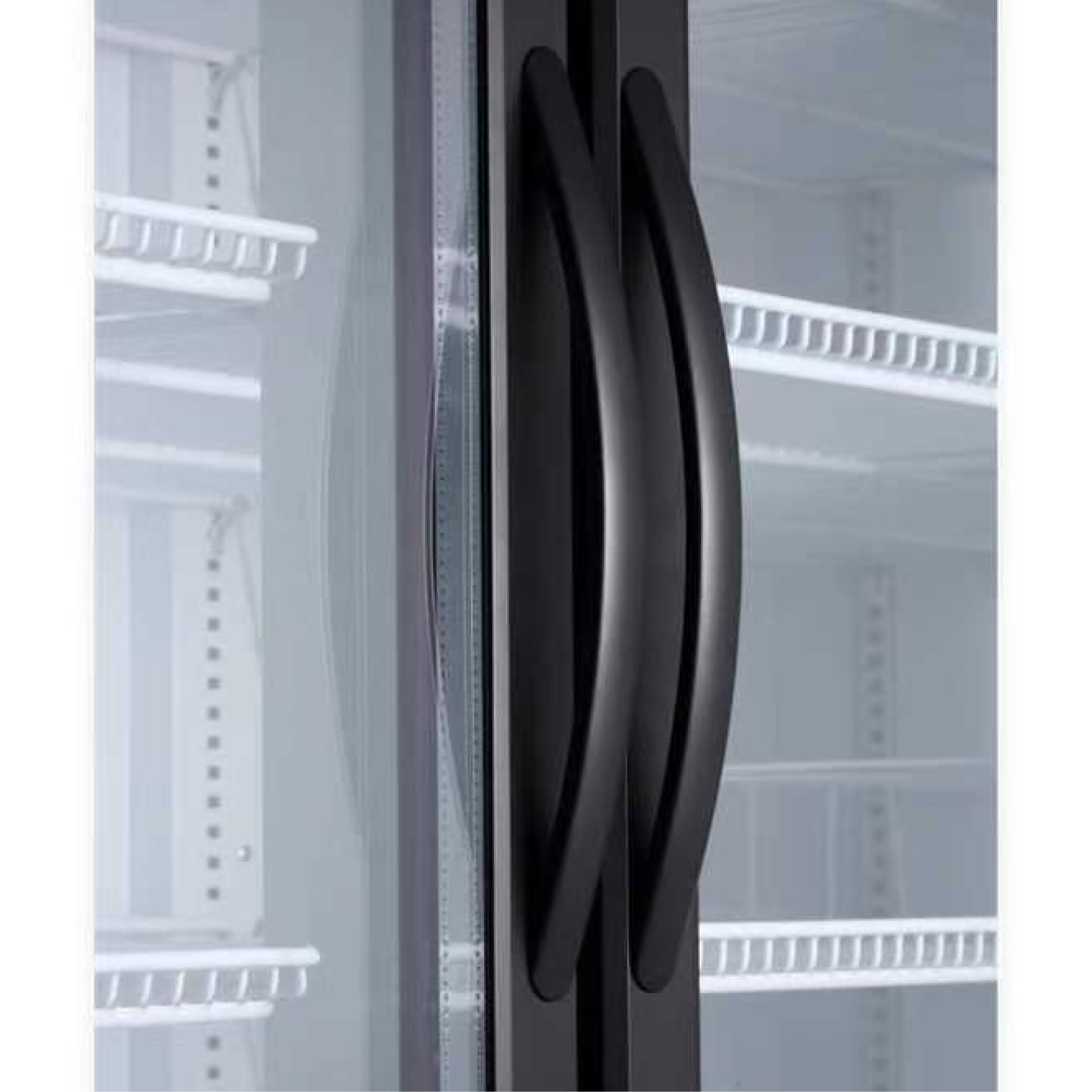 Close-up of black curved handles on upright glass door refrigerator with white interior shelves.