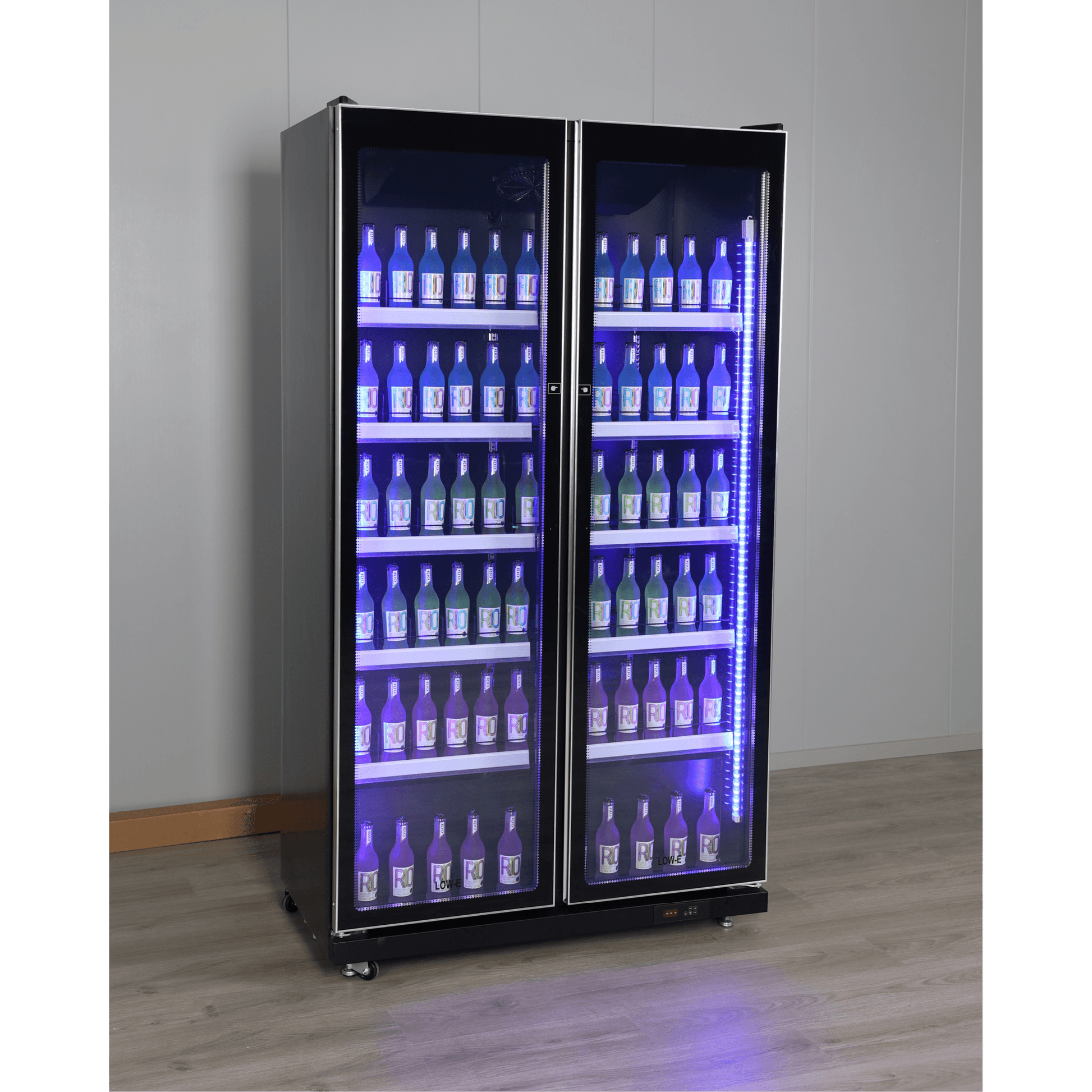 Black upright display refrigerator with two glass doors, illuminated shelves stocked with bottled beverages.