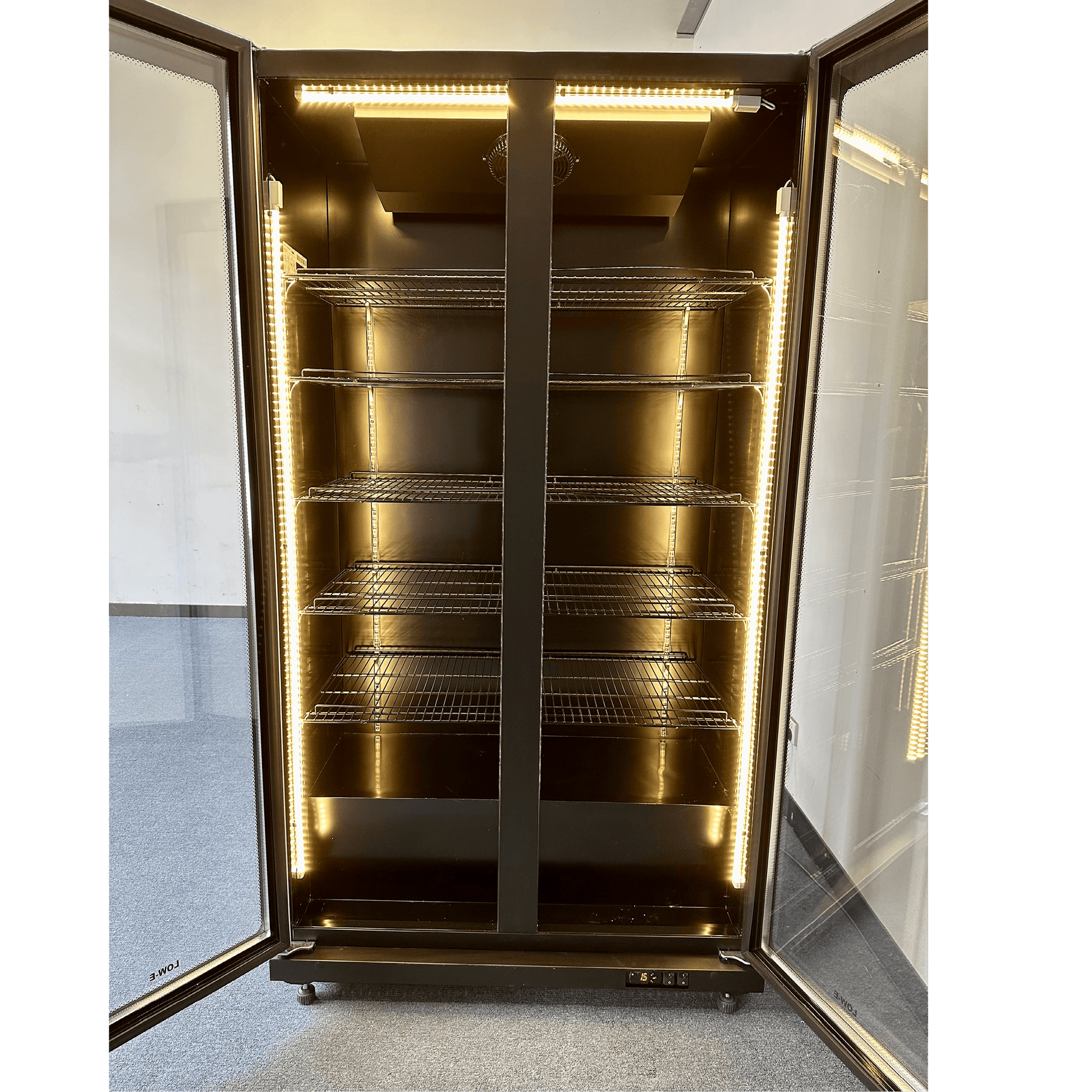 Black upright glass door display refrigerator with interior LED lighting and multiple adjustable shelves.