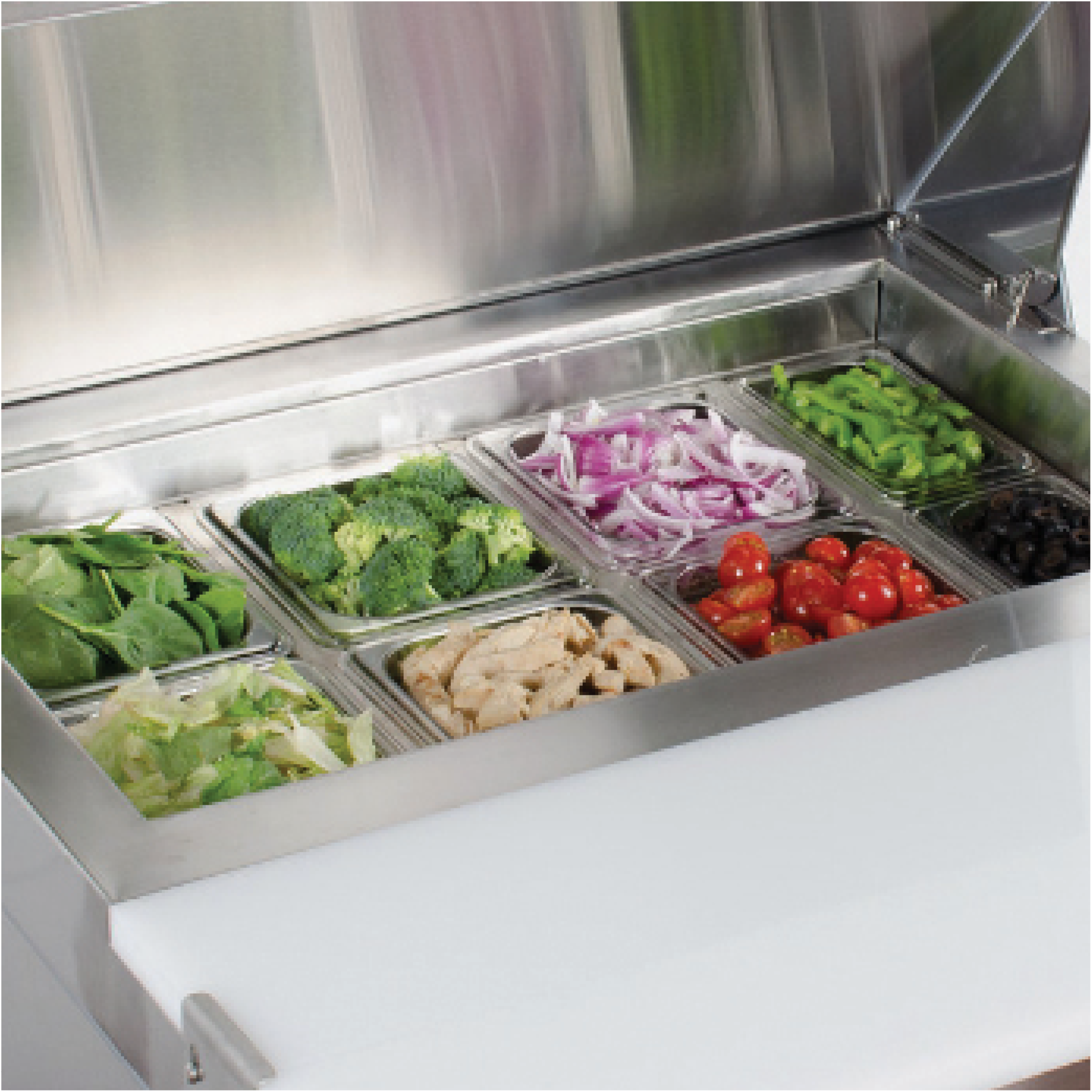 Stainless steel food prep refrigerator with one door, containing fresh spinach, broccoli, sliced chicken, cherry tomatoes,.