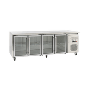 Stainless steel underbench refrigerator with four glass doors and adjustable shelves.