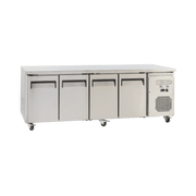 Stainless steel underbench refrigerator with four solid doors and vented cooling unit on right side.
