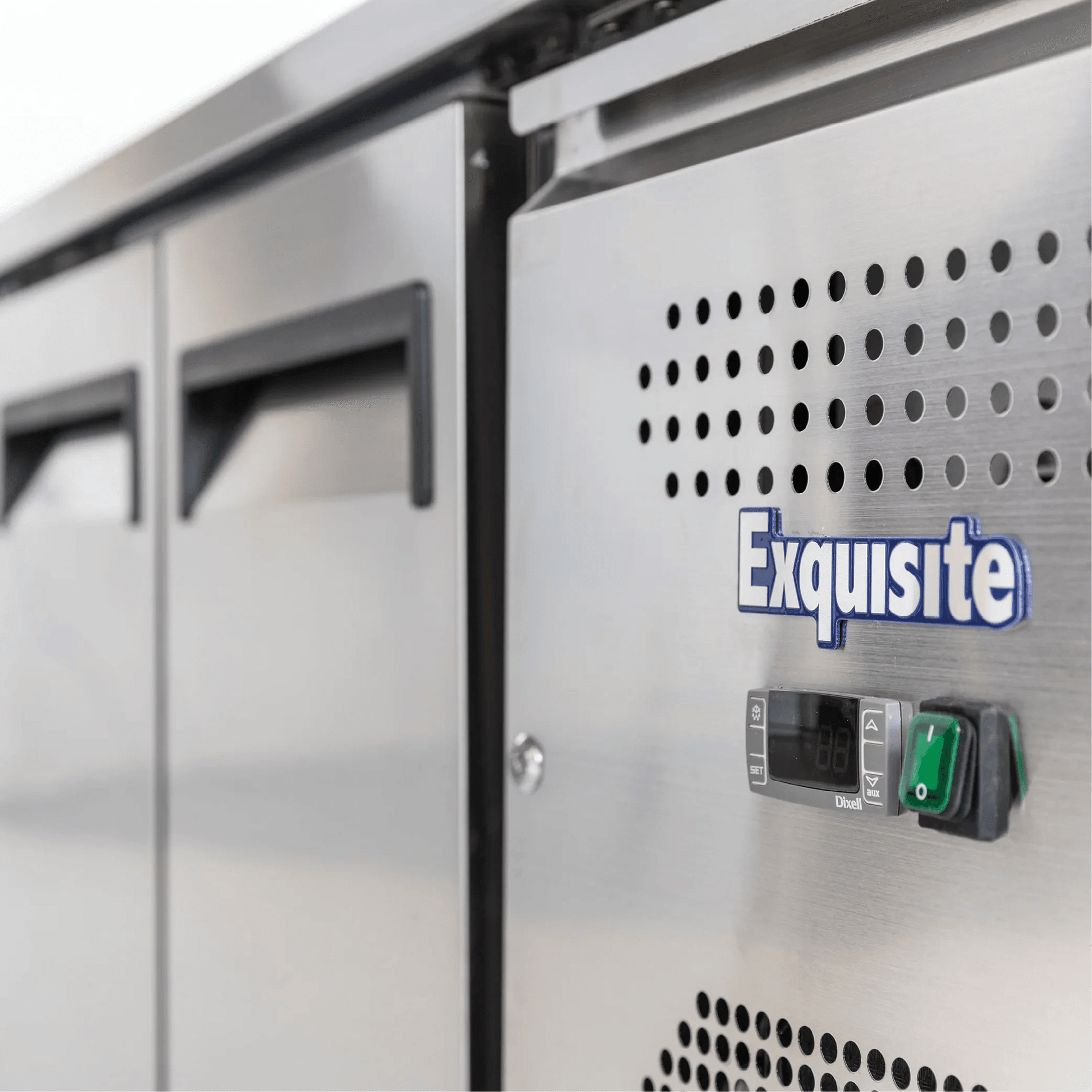 Stainless steel underbench freezer with three solid doors and digital control panel.