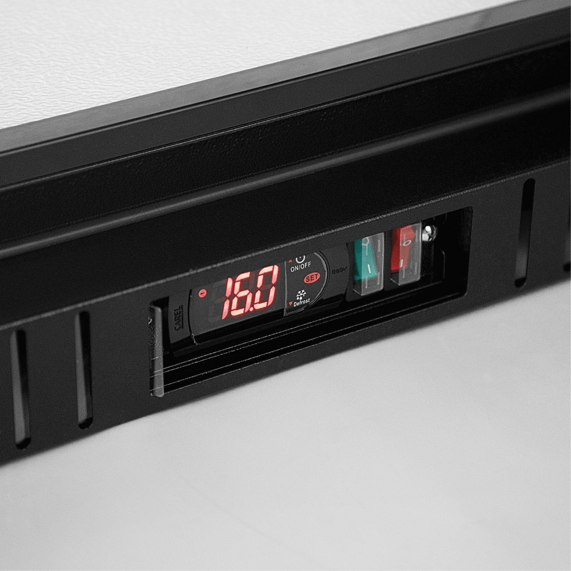 Digital temperature control panel with red LED display on black painted steel frame.
