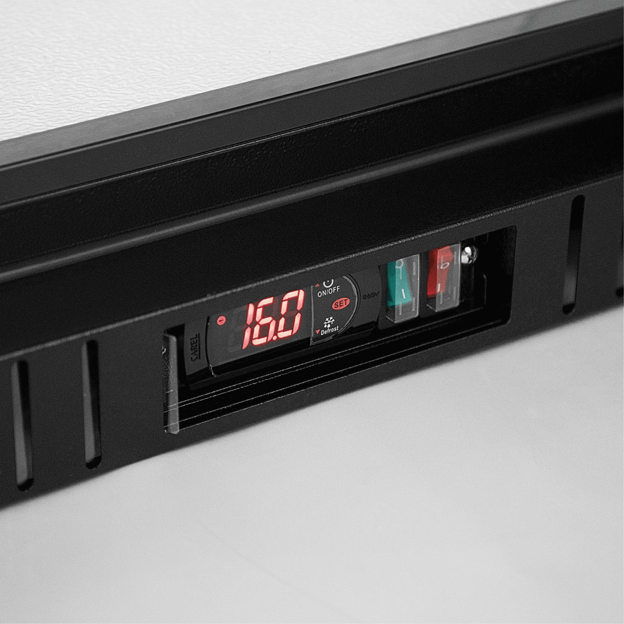 Digital temperature display panel with control buttons on black painted steel frame.