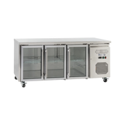 Stainless steel underbench refrigerator with three glass doors and vents on the right side, mounted on caster wheels.