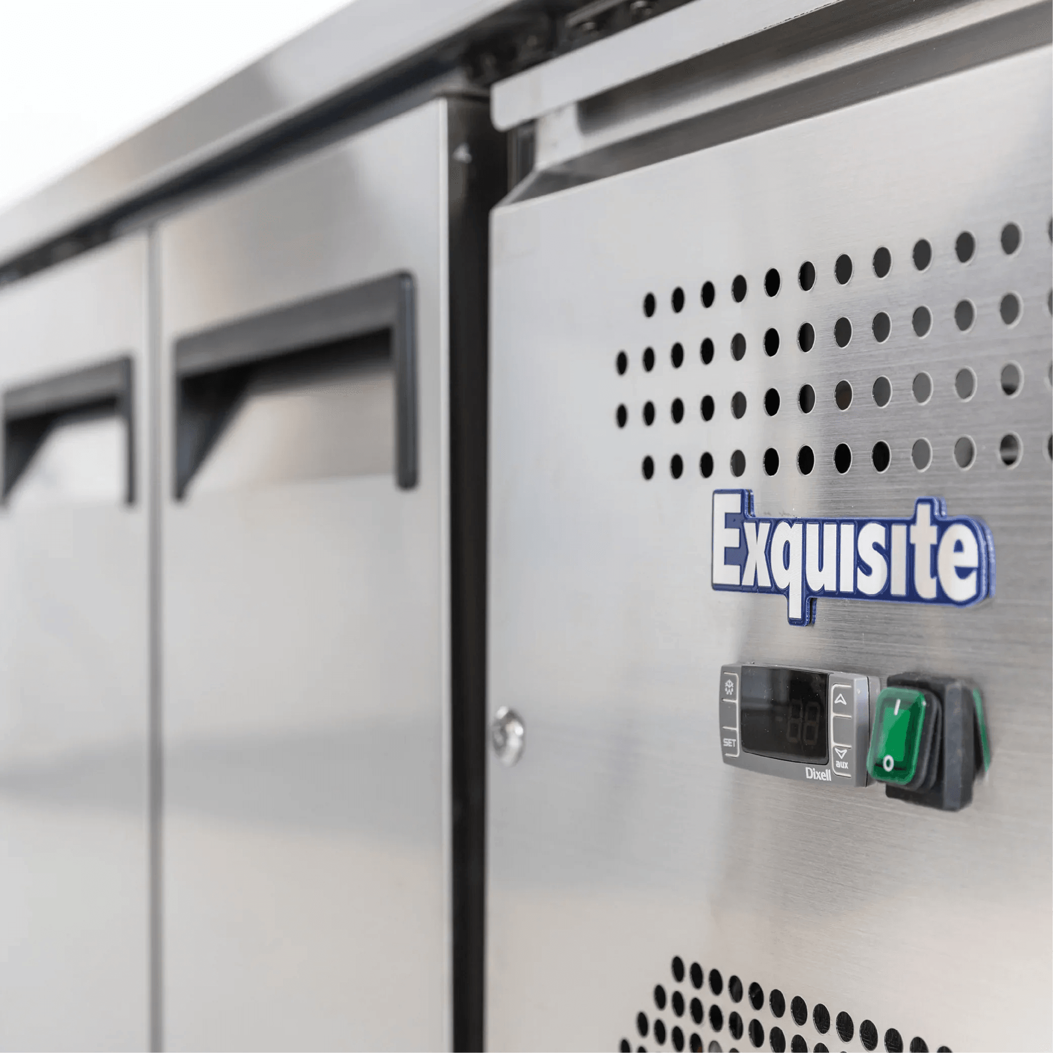Stainless steel underbench refrigerator with four solid doors and digital control panel.