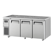 Stainless steel Turbo Air underbench fridge with three solid doors and refrigeration unit on left side.