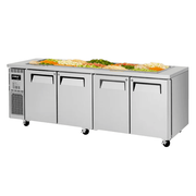 Stainless steel 4-door underbench salad prep fridge with casters and top salad containers.