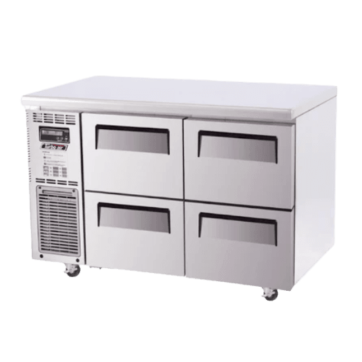Stainless steel Turbo Air underbench freezer with four drawers and ventilation panel on left side.