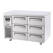 Stainless steel Turbo Air underbench freezer with six drawers and cooling vents on left side.