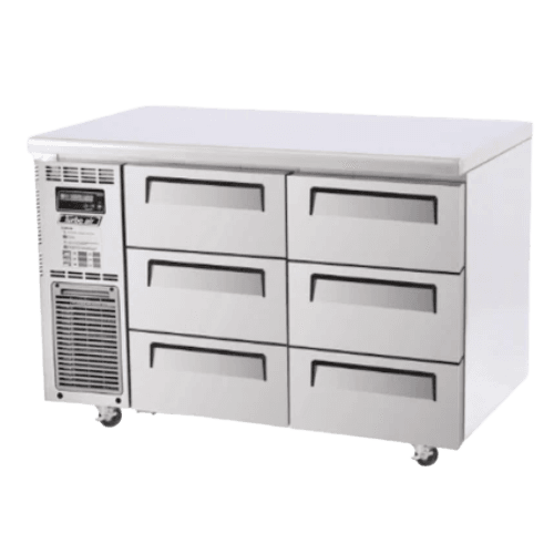 Stainless steel Turbo Air underbench freezer with six drawers and cooling vents on left side.