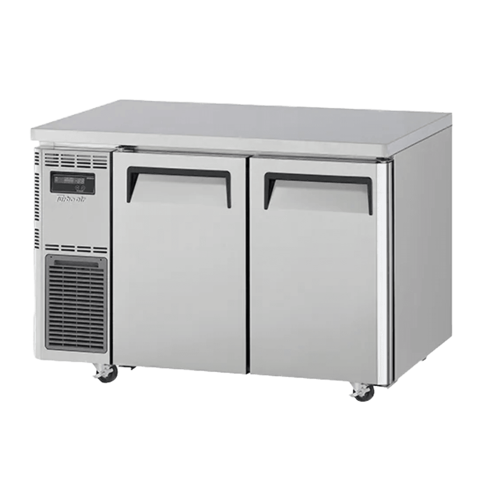 Stainless steel Turbo Air underbench fridge with two solid doors and caster wheels.