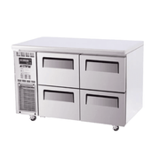 Stainless steel Turbo Air underbench fridge with four pull-out drawers and ventilation panel on left side.