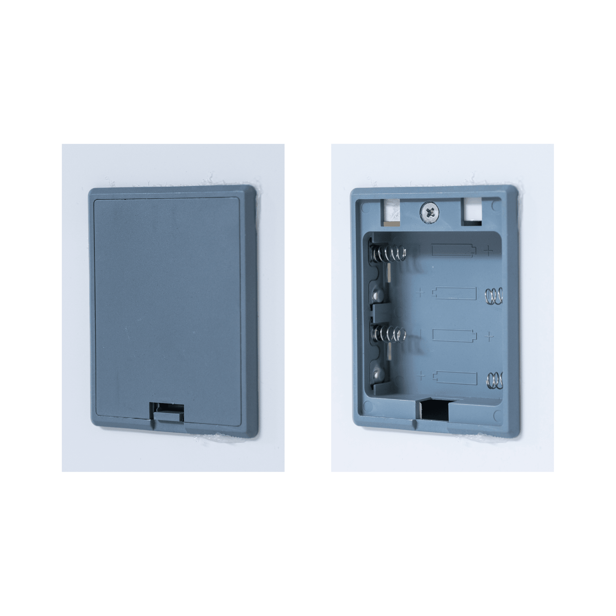 White plastic rectangular panel with one closed and one open compartment featuring internal clips and a latch.
