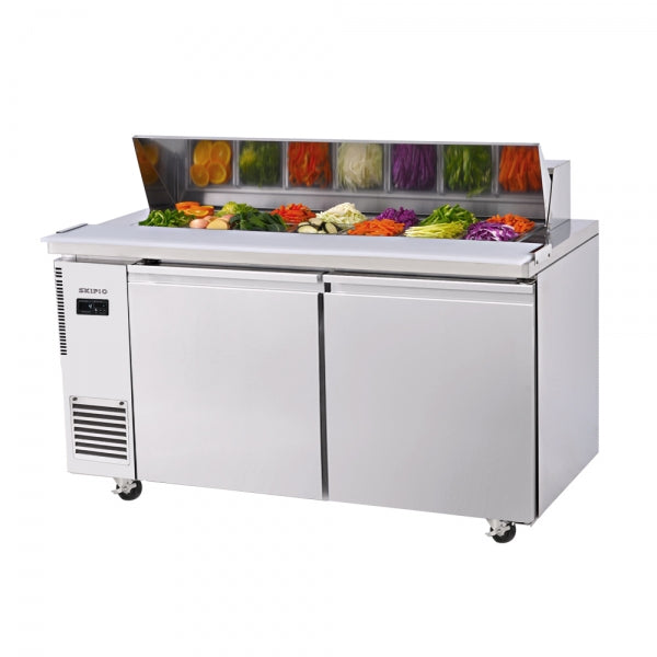 Stainless steel two-door salad prep table with clear sneeze guard and colorful fresh vegetables inside.