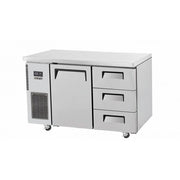 Stainless steel under counter fridge with one door and three drawers on caster wheels.