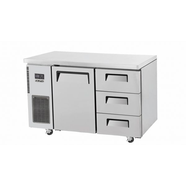 Stainless steel under counter fridge with one door and three drawers on caster wheels.