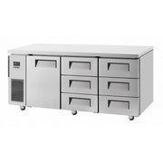 Stainless steel under counter fridge with one door left and six drawers on right side, caster wheels beneath.