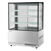 Commercial refrigerated cake display case with three glass shelves and stainless steel base.
